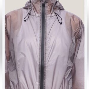 NWT. Retail $250. FREE PEOPLE- RAINS  Rain Jacket. Color flint, hood and zipper